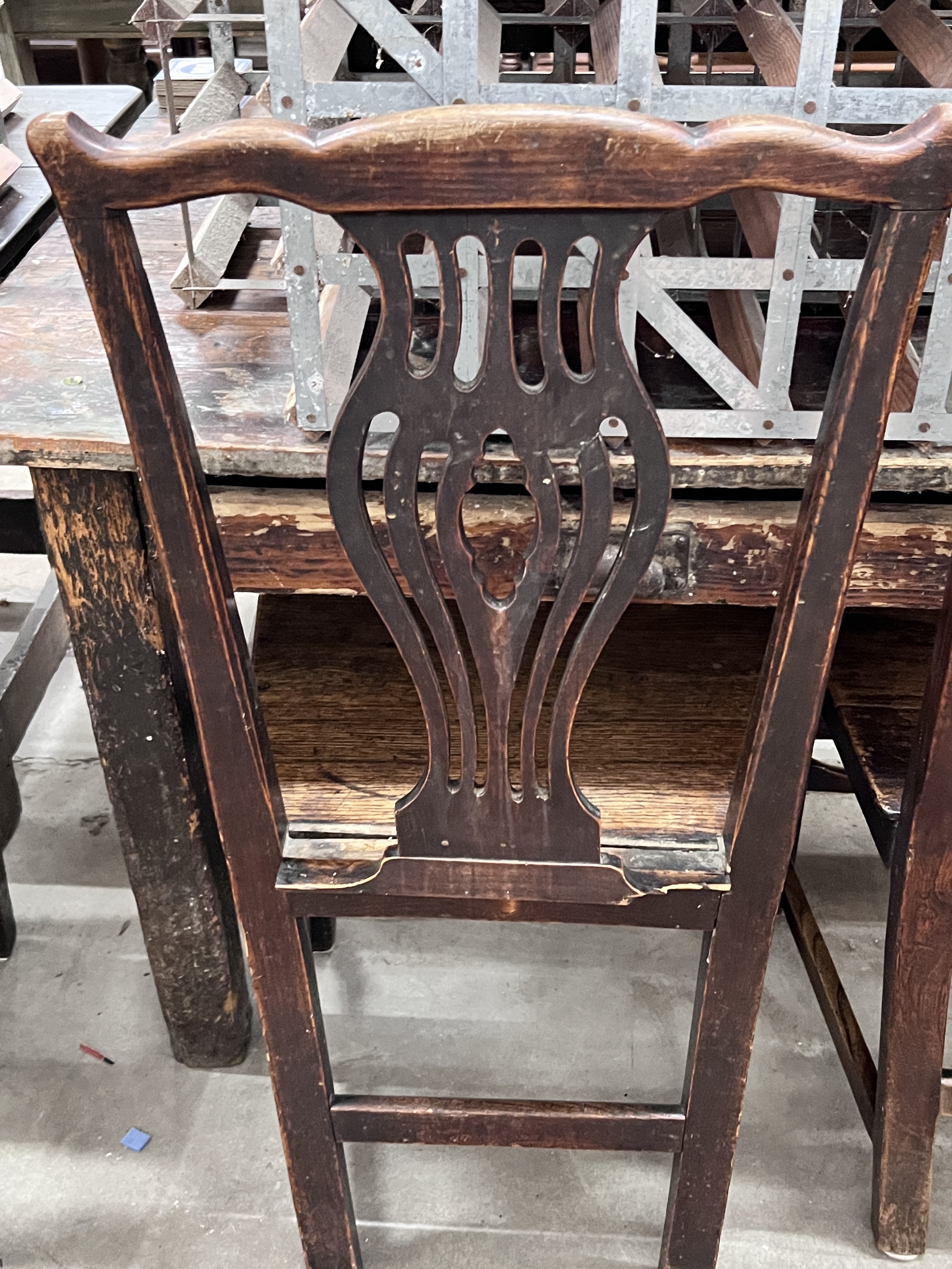 A set of four George III provincial fruitwood and oak wood seat dining chairs, width 49cm, depth 39cm, height 94cm